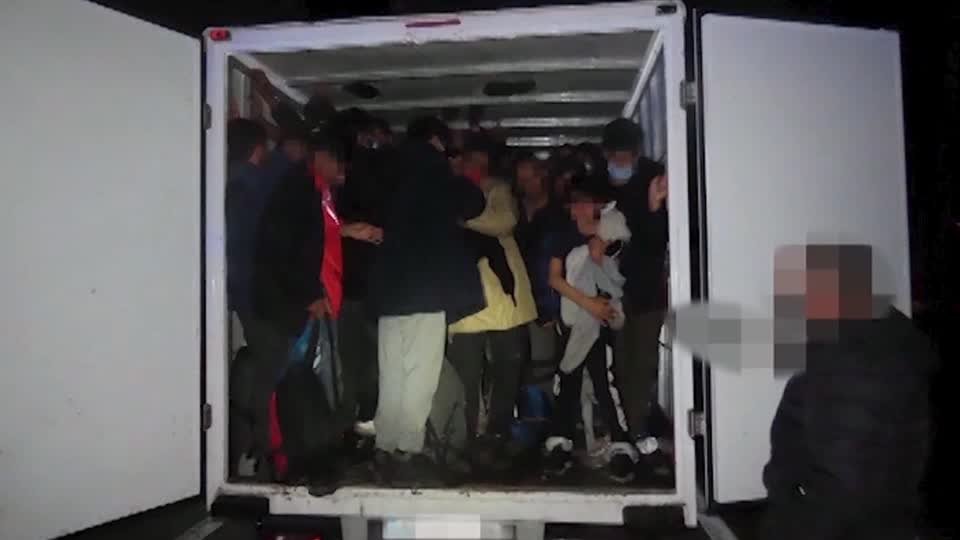 Police images showed how 77 people, including four children, were crammed into the filthy cargo compartment of a small truck | Source: Keyframe from Reuters video