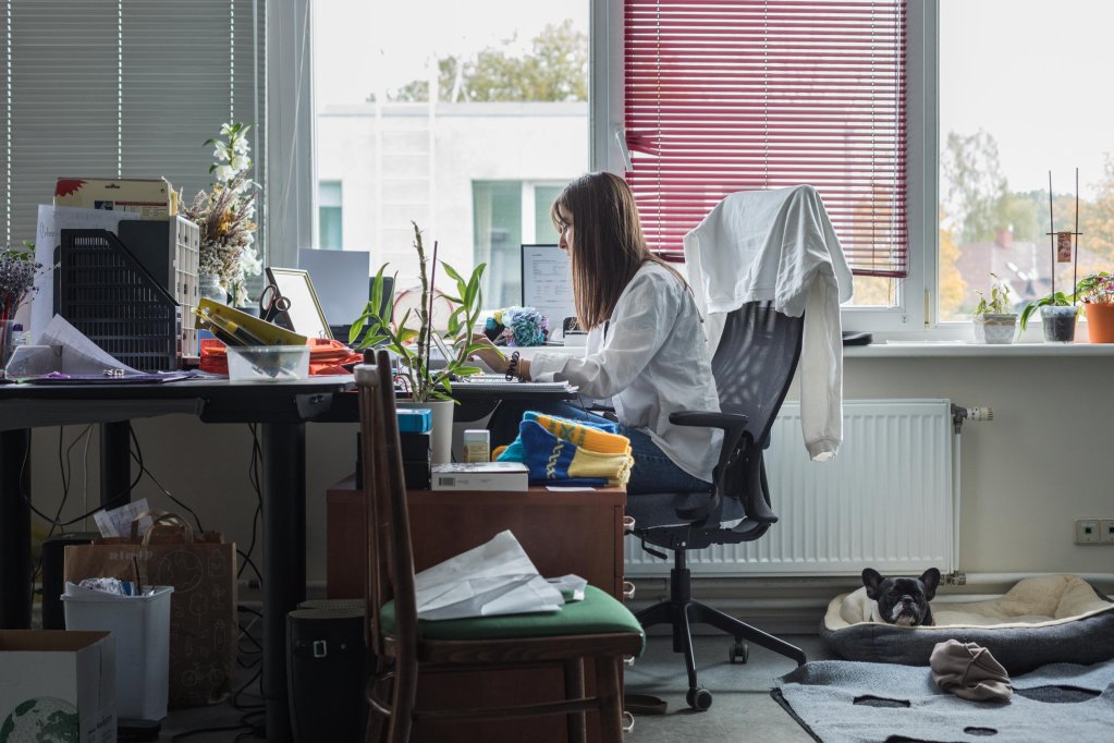 Irisha sitting at her desk on the 1st floor of the Tavi Draugi warehouse in Riga, Latvia | Photo: Martin Thaulow