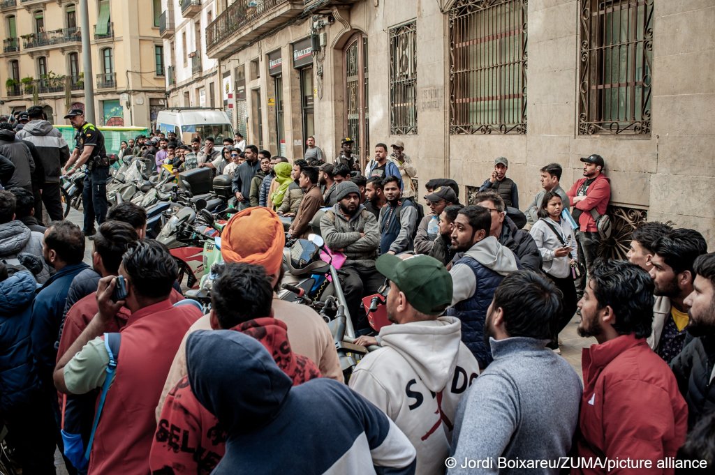April 24, 2026, Barcelona, Spain: People line up in the Gothic Quarter of Barcelona as they seek assistance with migrant regularization documents and procedures promoted by the Spanish government, which is expected to grant legal status to around 500, 000 migrants | Photo: Jordi Boixareu/ZUMA Press Wire