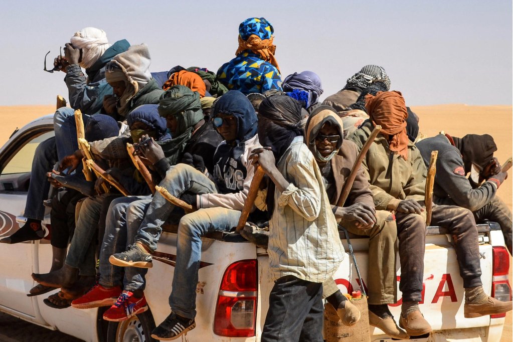 
From file: A group of migrant men mainly from Niger and Nigeria sit in the back of a pickup during a journey across northern Niger’s Air desert towards the Libyan border post of Gatrone, January 22, 2019 | Photo: Souleymane Ag Anara/AFP 