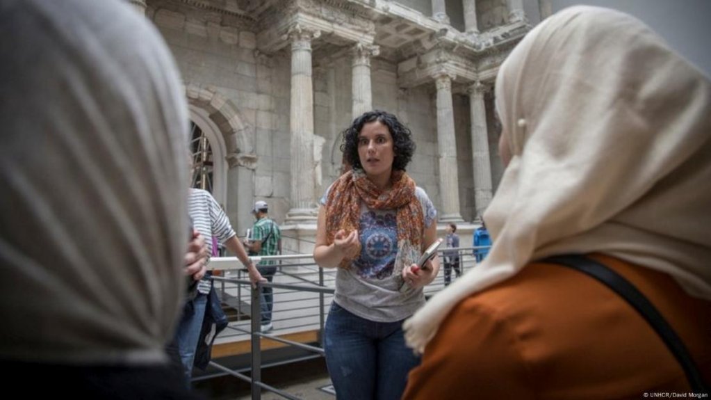 Cultural mediator: Kefah Ali Deeb guides visitors through a museum in Berlin | Photo: UNHCR/David Morgan