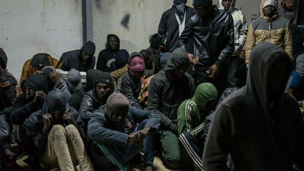 More than 350 migrants who were intercepted by the Libyan coast guard in a detention center in Libya, in January 2018 | Photo: ANSA