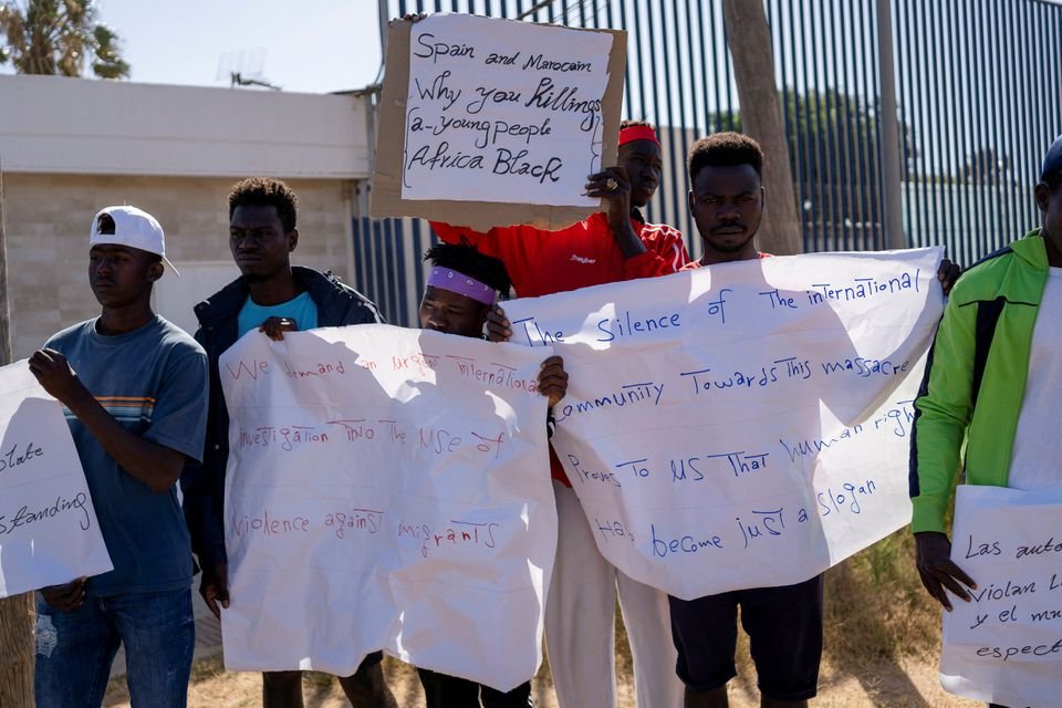 Protesters gather outside the CETI reception center in Melilla after at least 23 migrants died trying to reach the Spanish enclave, in Melilla, Spain, June 27, 2022. | Photo: Reuters