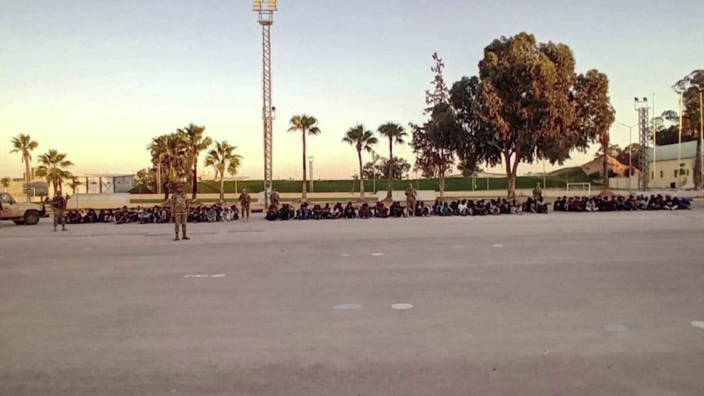 People in the Libyan desert the Libyan military says are detained migrants | Source: still from Reuters video