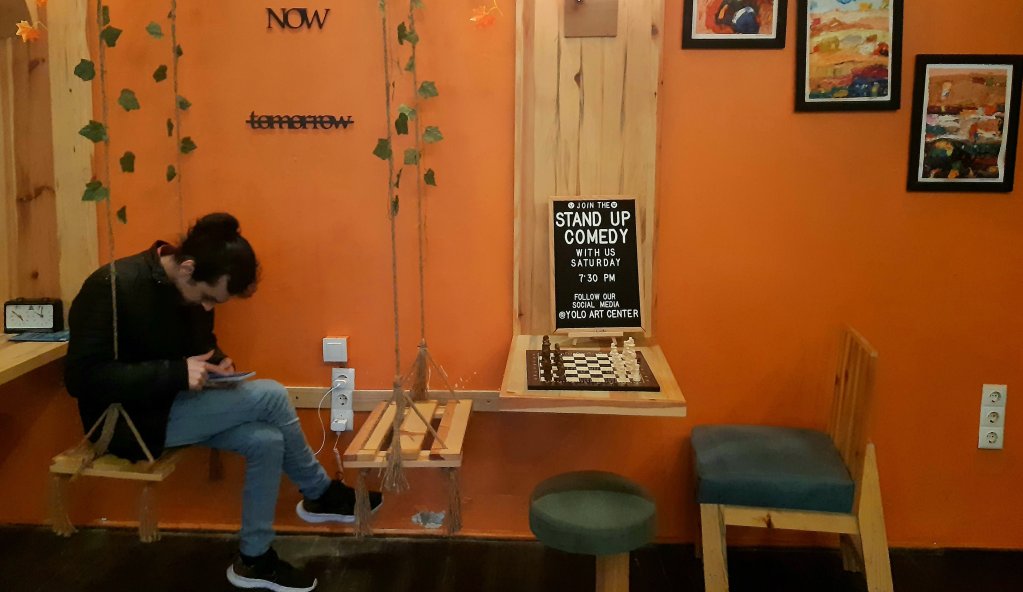 The bright orange café offers cultural events including stand-up comedy in Arabic | Photo: Filippo Cicciu