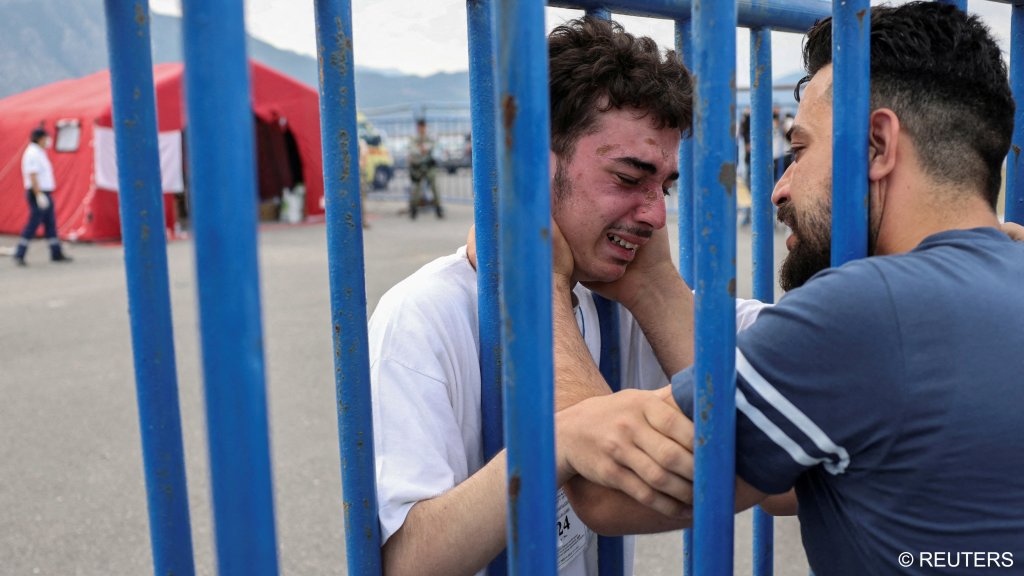 Mohammad survived the shipwreck and enjoys a tearful reunion with his older brother Fadi who flew from the Netherlands to be with him | Photo: Stelios Misanas / Reuters