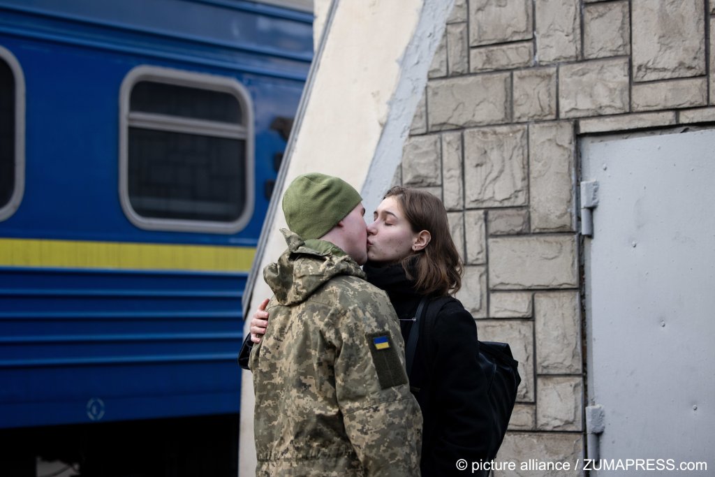 Ukrainian soldier bids farewell to his wife at Lviv railway station in western Ukraine