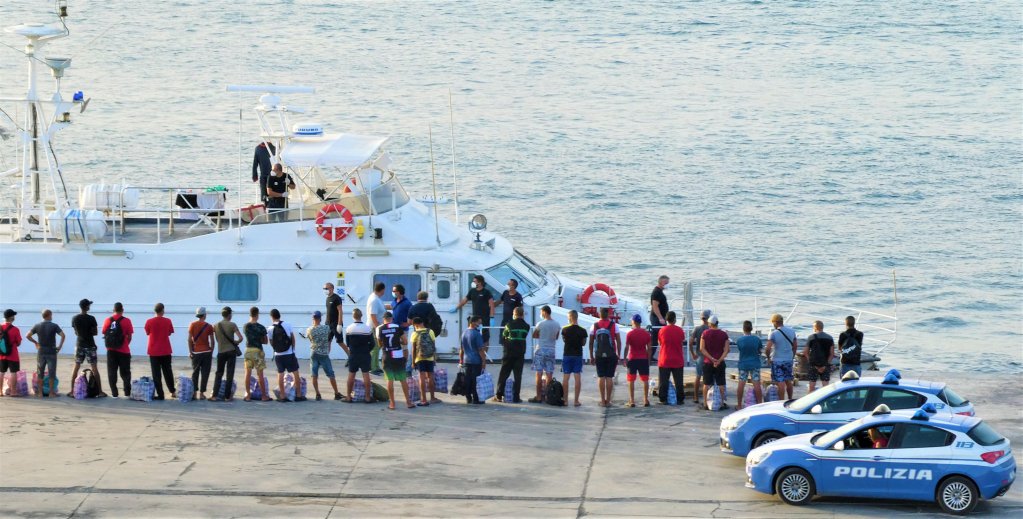 From file: Transfer of migrants from the commercial port aboard patrol boats to a quarantine ship, Lampedusa, Sicily | ANSA/ELIO DESIDERIO