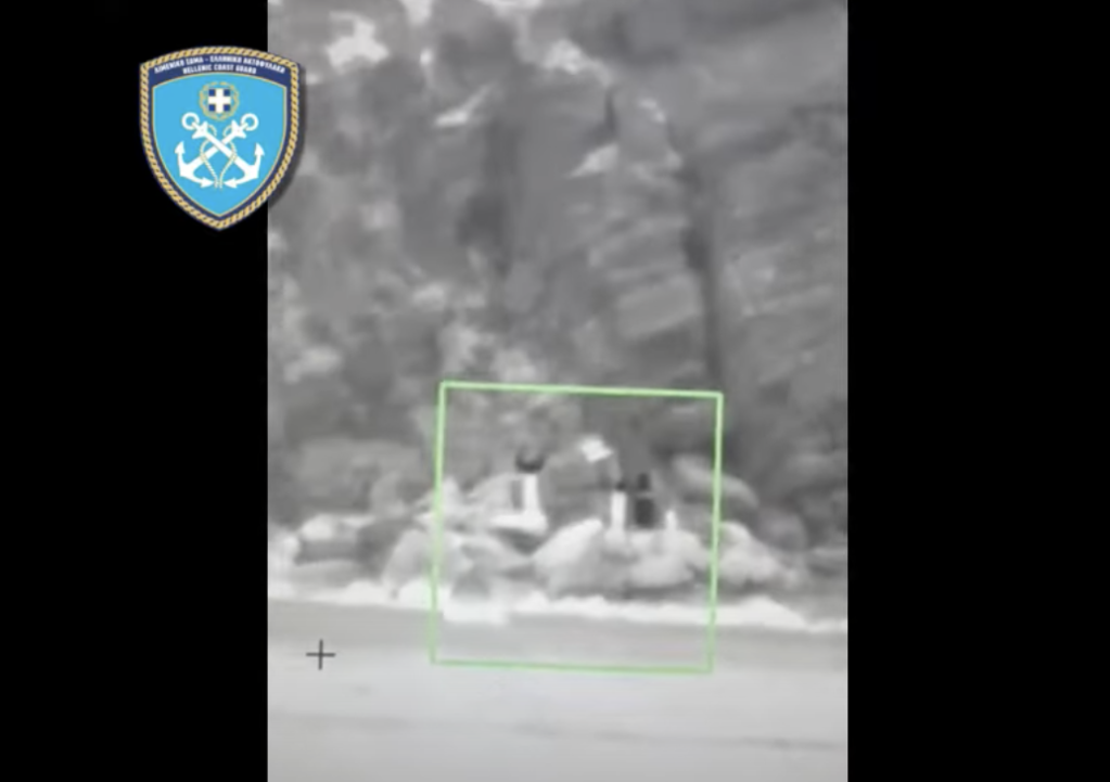 Frame from YouTube Channel of the Hellenic Coast Guard, showing people on an islet in the western Aegean Sea waving for assistance on November 1, 2022