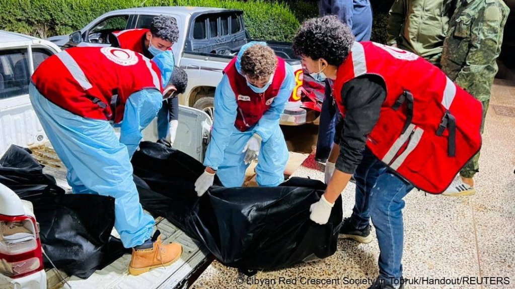 File photo: Red Crescent volunteers carry a body recovered during rescue operations after a boat carrying migrants broke down in the Mediterranean Sea, in Tobruk, Libya | Photo via Reuters