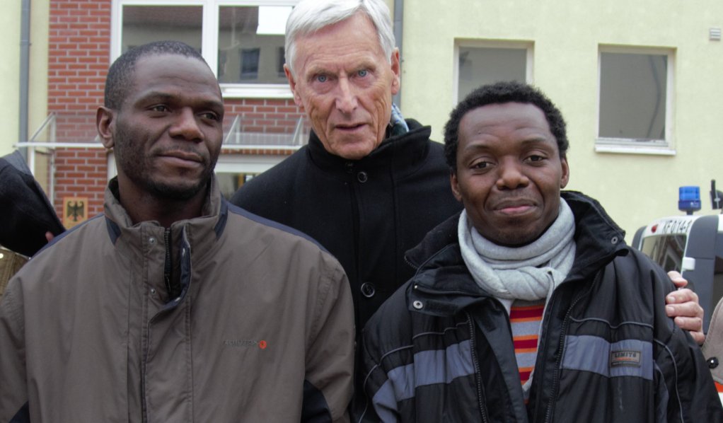 L to R, Former asylum seeker Cyprien Cirez Fathey, lawyer Dieter Bollmann, former asylum seeker Freddy Ovongo Meba |
Photo: Michael Kurzwelly