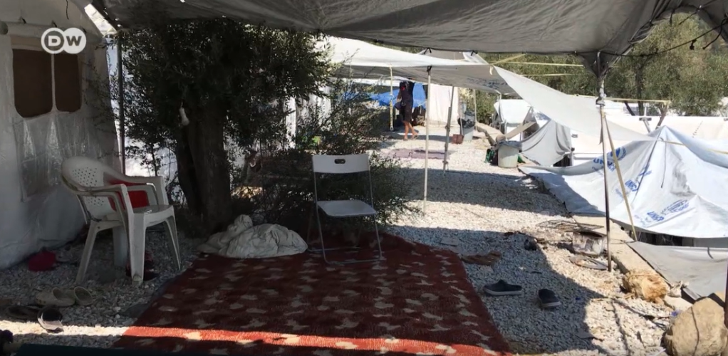 From file: An unofficial camp grew up alongside Moria camp and was almost as big as the official one in 2018 when DW visited | Source: Screenshot DW video