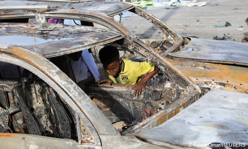 File photo: A boy looks through the wreckage of vehicles destroyed at the scene of an explosion outside a restaurant where patrons were watching the final of the Euro 2024 football tournament on TV, in Bondhere district of Mogadishu, Somalia | Photo: Feisal Omar/Reuters