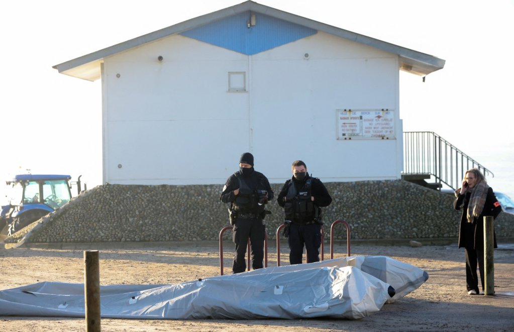 French police stand guard on a deflated dinghy after the rescue operation, which resulted in the death of one person near Calais on January 14 |  Photo: Reuters