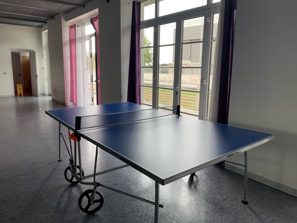A table tennis table stands in the large reception room in the community house for unaccompanied minors in Monfalcone | Photo: Emma Wallis / InfoMigrants