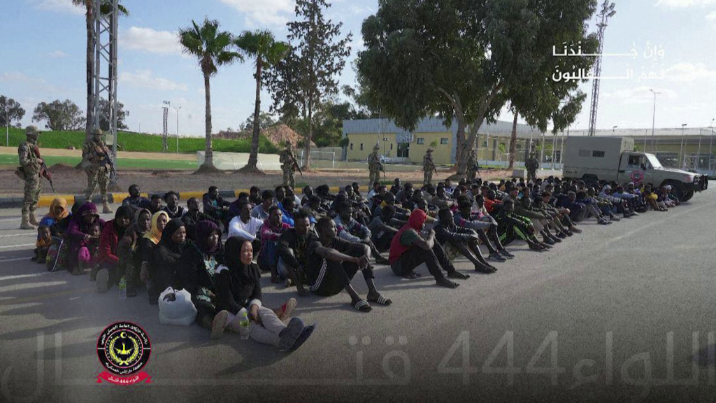 People in the Libyan desert the Libyan military says are detained migrants | Source: still from Reuters video