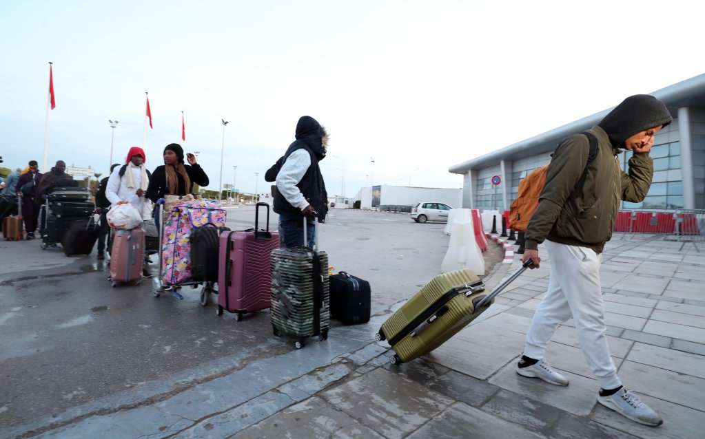 File photo: Ivorian migrants line up to take a special flight to Abidjan at Tunis airport, Tunis | Photo: Mohamed Messara / EPA