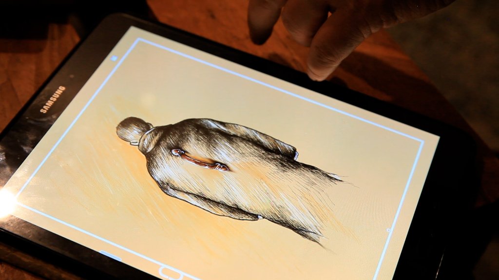 Man with a handle - drawing by Hossien Rezaye on his tablet | Photo: Tina Xu 2021