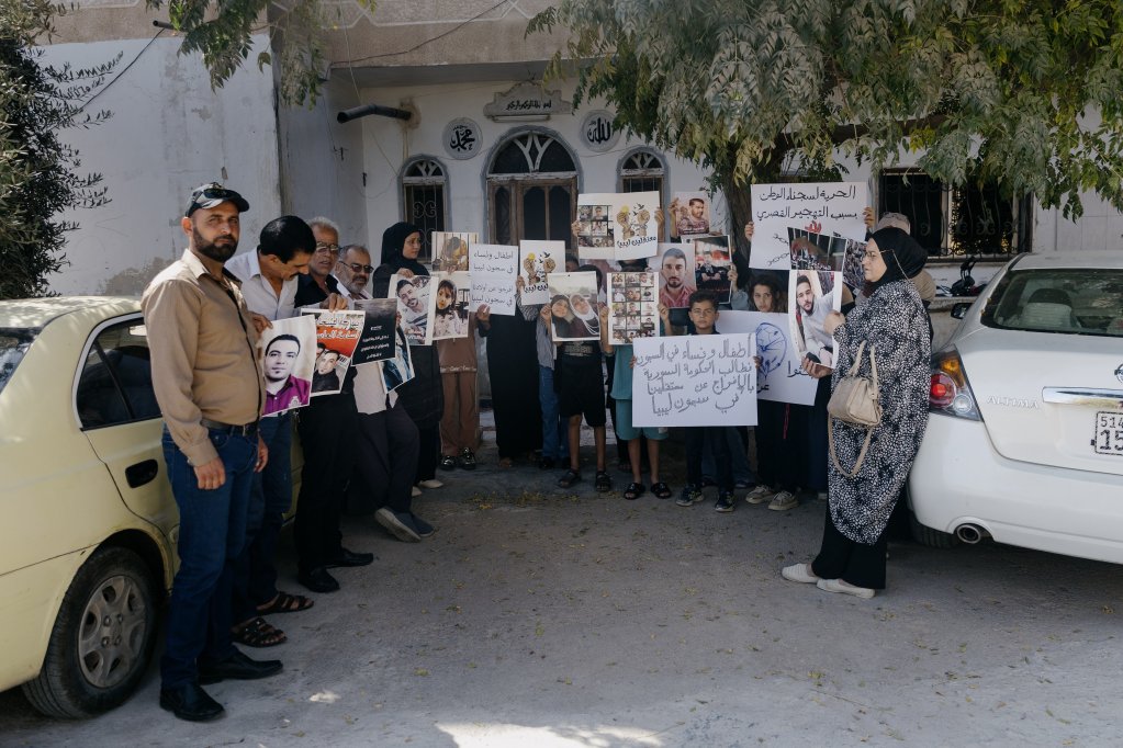 Families of people missing in Libya gather in front of a family home in Daraa, Syria, September 24, 2025 | Photo: Valentina Camu/Divergence