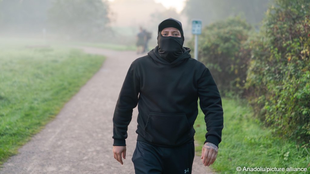 As part of the recent rise in anti-migrant rallies in the UK, balaclavas have been coopted as a symbol of far-right extremists, resulting in a ban of such face coverings at some protests. This individual was photographed near Gravelines in France, and is reported to be part of a self-styled vigilante group to stop migrants | Photo: Anadolu Agency/picture-alliance
