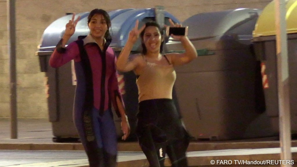 Women gesture as they celebrate, in Ceuta, Spain, July 28, 2026, in this screengrab taken from a handout video | Photo: Faro TV / Reuters