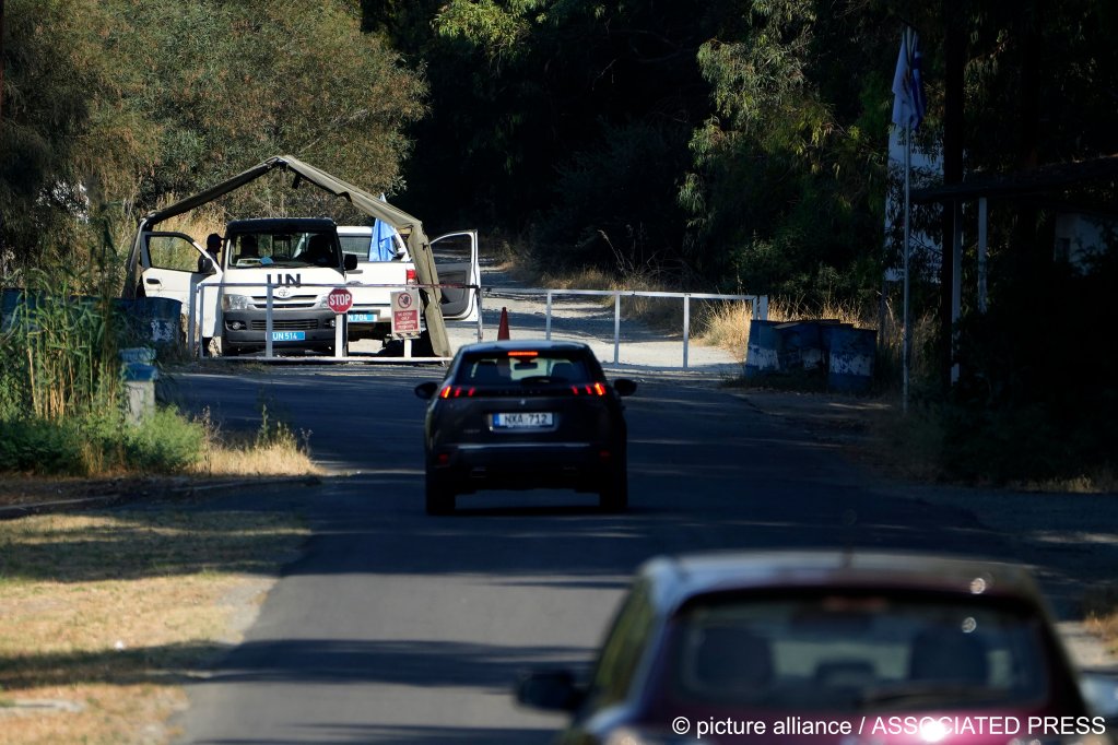 File photo: Cars pass UN peacekeepers in June 2024, after a group of migrants became stranded in the area between the two parts of Cyprus and refused to move | Photo Petros Karadijias / AP Photo