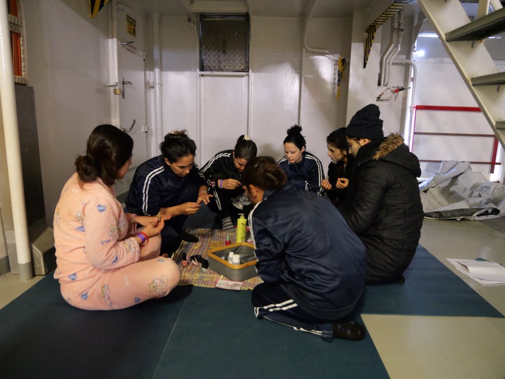 A group of Syrian women participate in a beauty and wellness session organized by MSF on board the Geo Barents | Central Mediterranean Sea, February, 2024 | Photo: Sou-Jie van Brunnersum