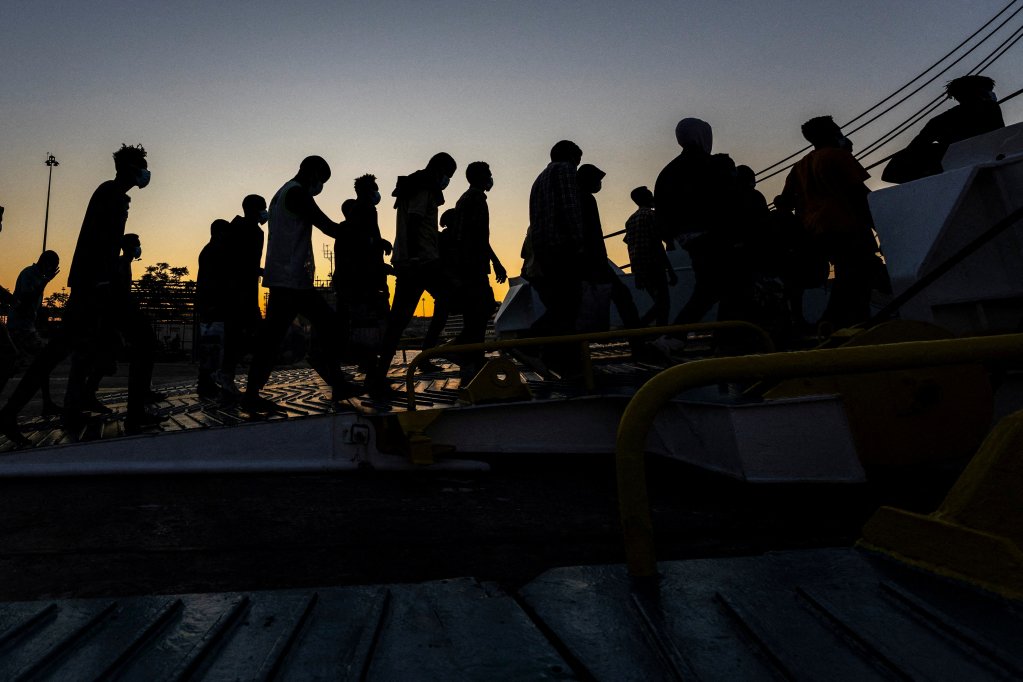 A group of migrants are seen boarding a ferry bound for mainland Greece on July 11, 2025, having arrived on Crete just days earlier | Photo: REUTERS/Nicolas Economou