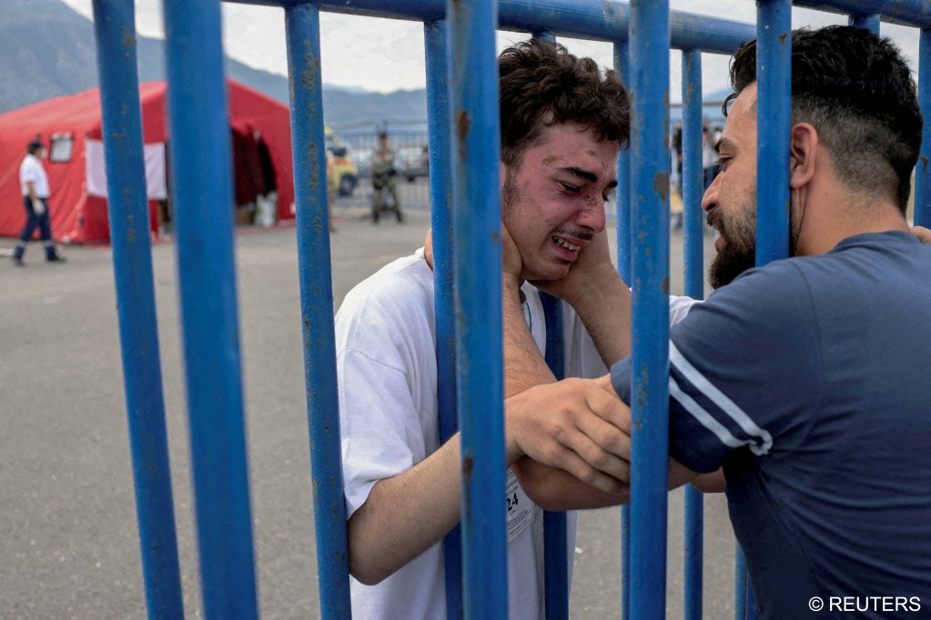 18-year-old Mohammed from Syria is reunited with his brother Fadi, who came from the Netherlands to meet him at the port of Kalamata, Greece, June 16, 2023 | Photo: Stelios Misanas