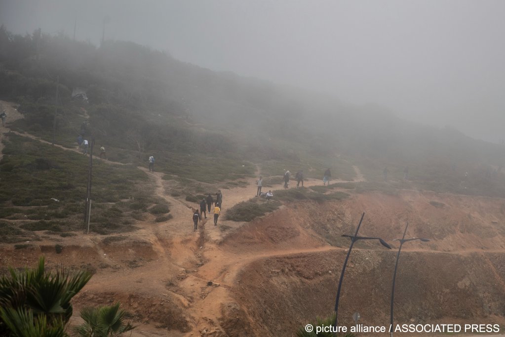 File photo: Migrants cross the hills near the Moroccan town of Fnideq, near the Spanish enclave Ceuta in May 2021. On this most recent attempt, many retreated to the hills, after their crossing attempts were foiled by the Moroccan authorities | Photo: Mosa'ab Elshamy / picture alliance / Associated Press