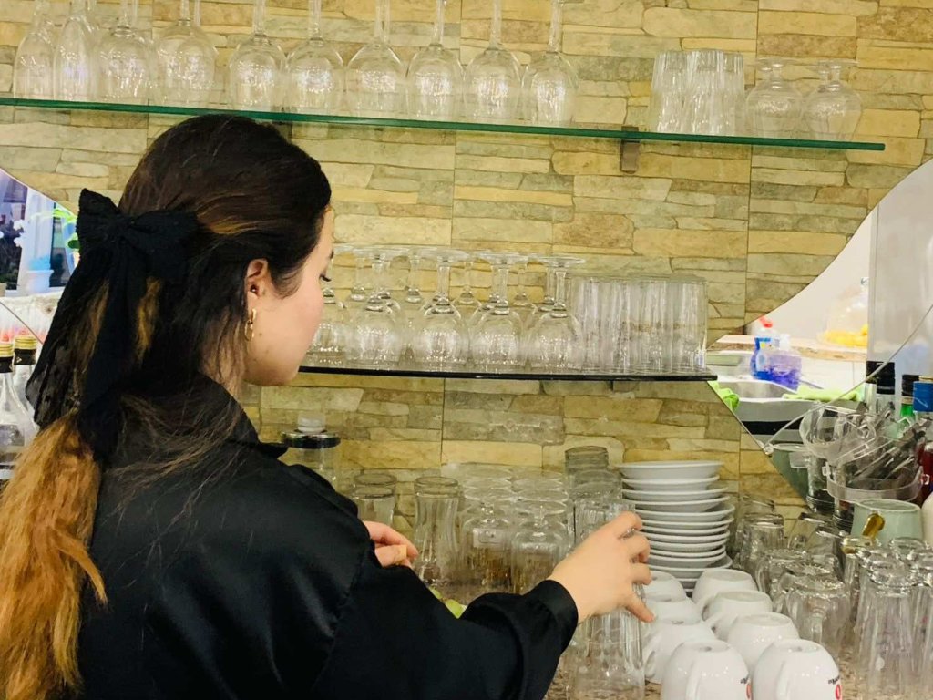 Hassinah Rezai works at a restaurant to support herself and her family | Photo: Hassina Rezai