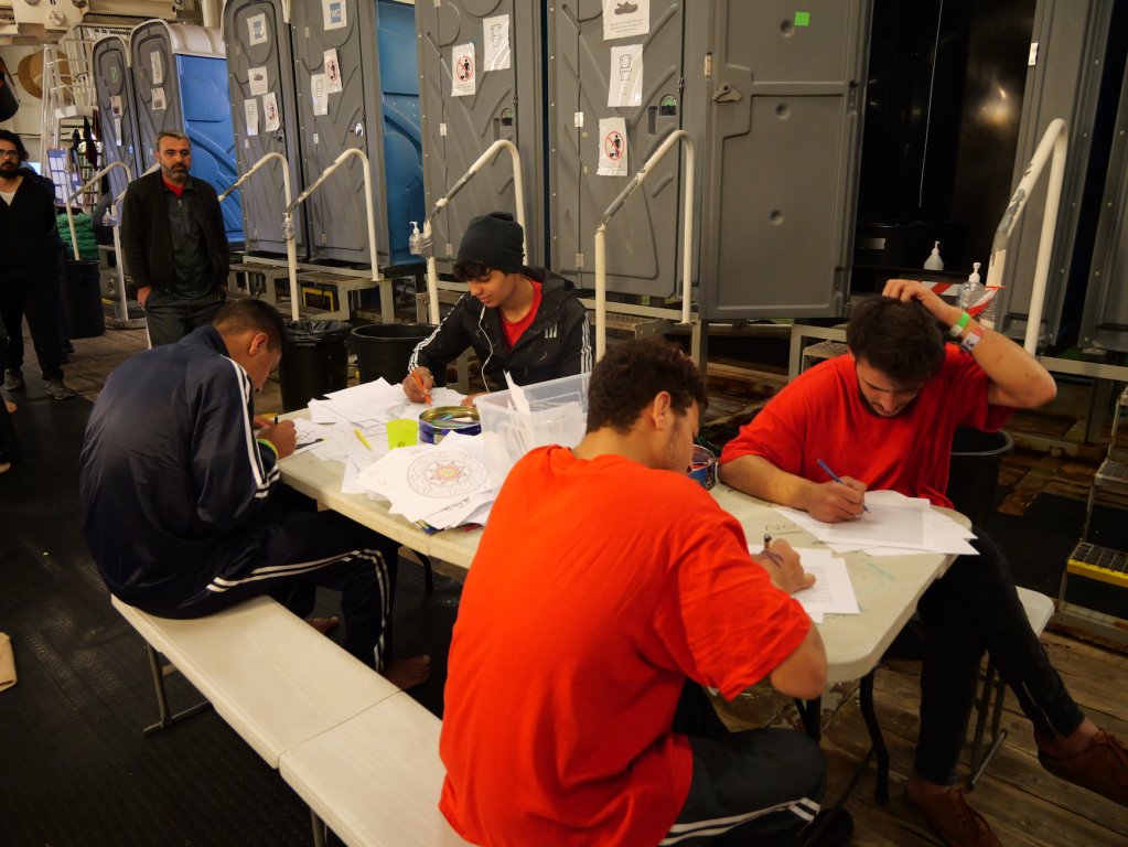 Survivors rescued from distress in the Central Mediterranean participate in art therapy on board the MSF operated Geo Barents ship | February, 2024 | Photo: Sou-Jie van Brunnersum