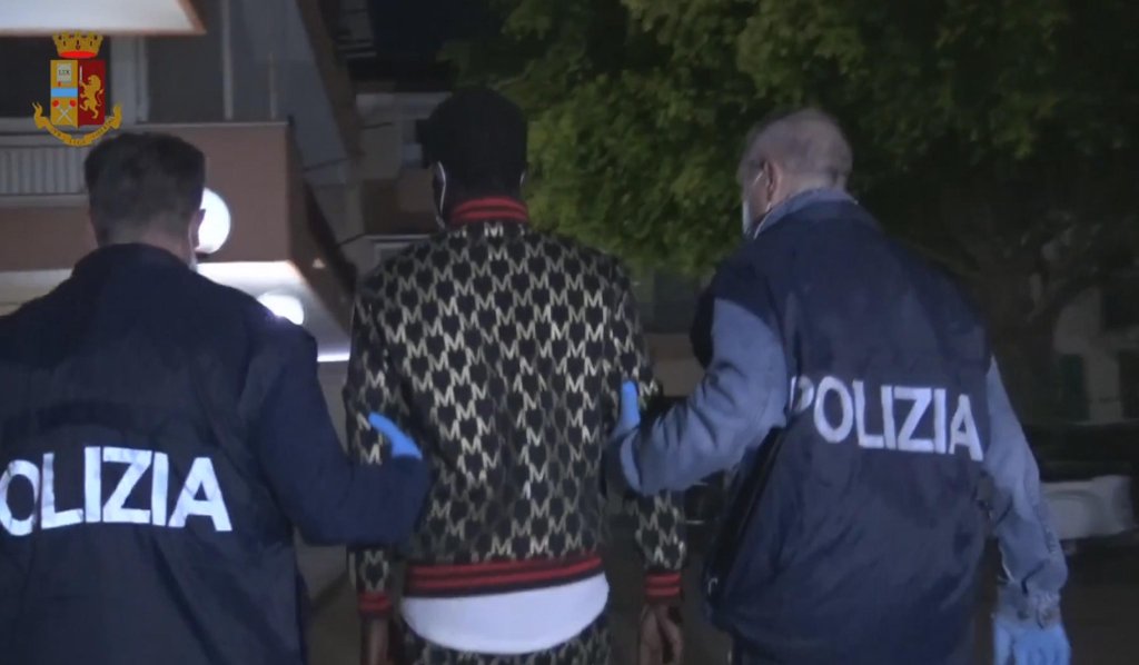 From file: Italian police arresting a man in connection with an investigation into human trafficking in Catania, Sicily  |Photo: ANSA/Polizia di Stato