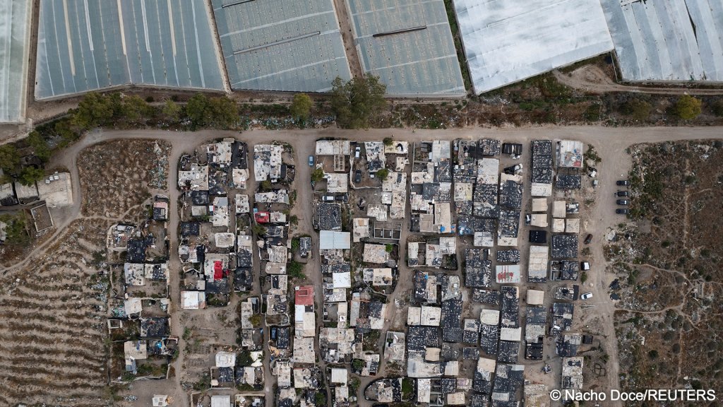 A drone view shows a shanty town, where documented and undocumented migrants from Morocco and sub- Saharan Africa live next to plastic-covered greenhouses in Almeria. Charities say as many as 10,000 may live in sub-standard housing like this | Photo: Nacho Doce / Reuters