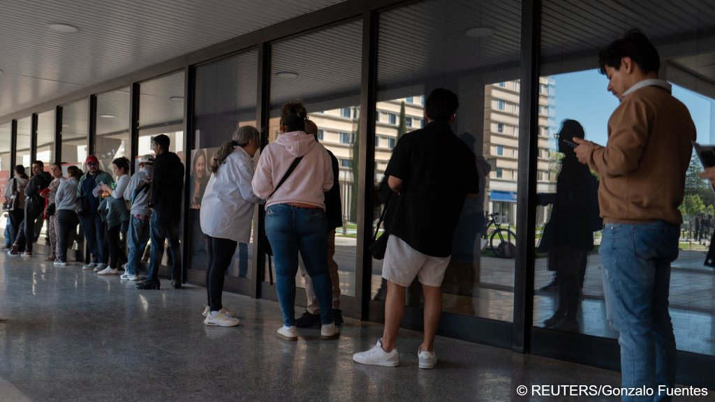 Migrants queue outside this transport office in Madrid in April to obtain a travel history certificate to help prove their length of residence | Photo: REUTERS/Gonzalo Fuentes