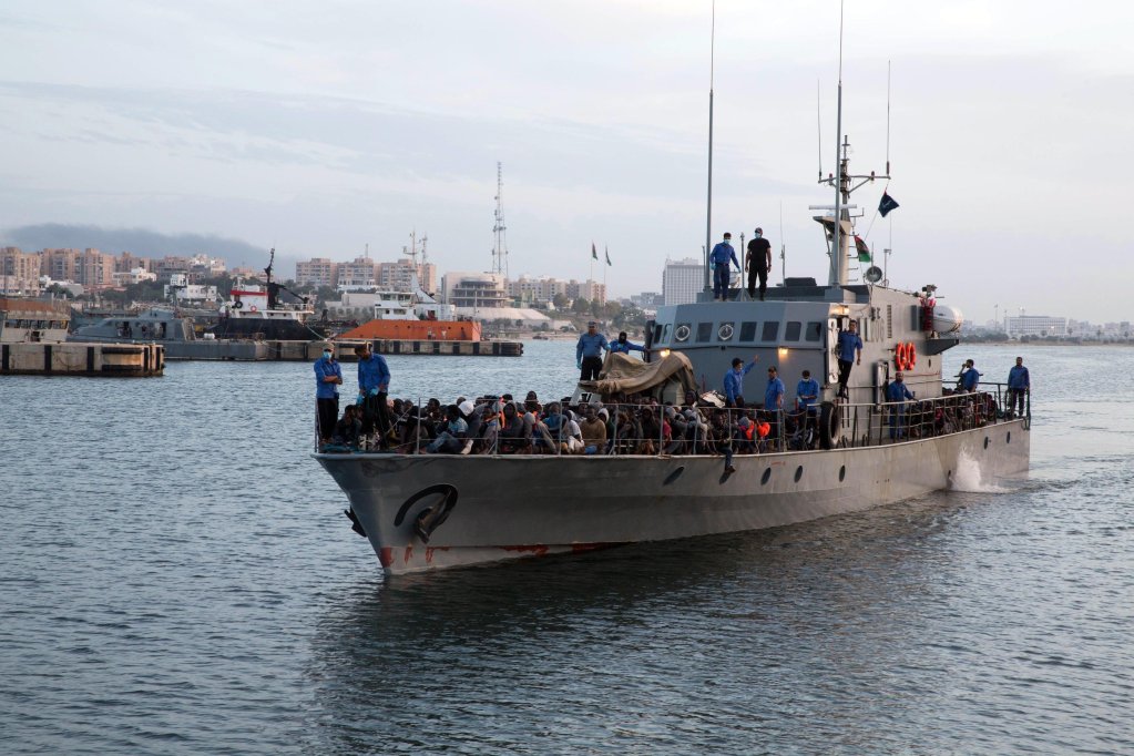 Migrants on board a Libyan Coast Guard vessel in the Mediterranean off the Libyan coast arrive at a naval base in Tripoli, Libya | Photo: EPA