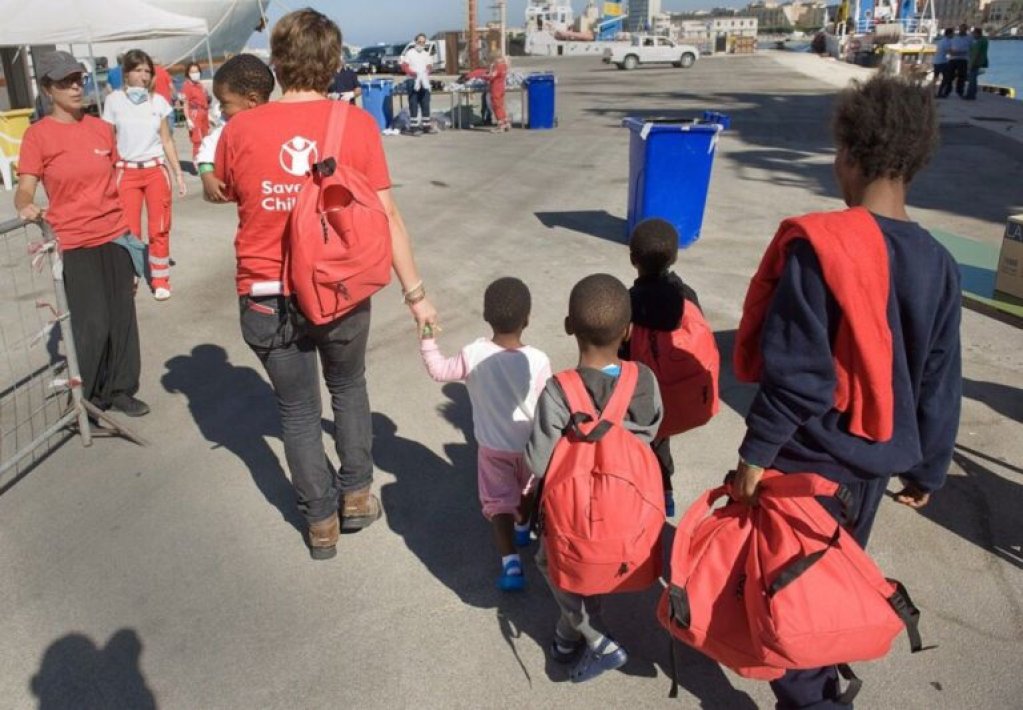 File photo used as illustration: Migrant children assisted by Save the Children volunteers after disembarking on Lampedusa | Photo: Save the Children