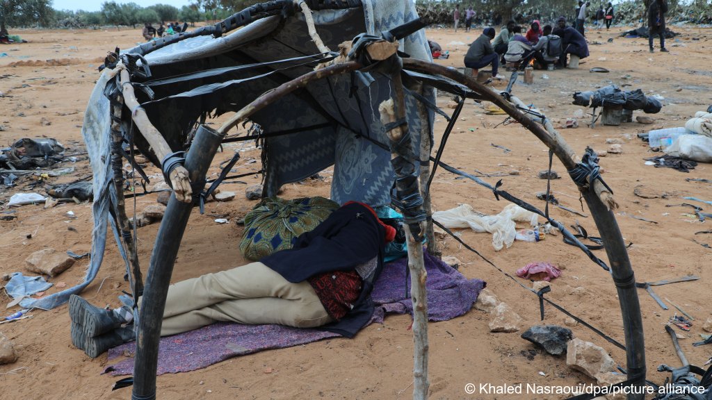 From file: A migrant from sub-Sahara Africa rests inside the remains of a tent in a camp in Jebeniana in Tunisia | Photo: Khaled Nasraoui / dpa / picture alliance