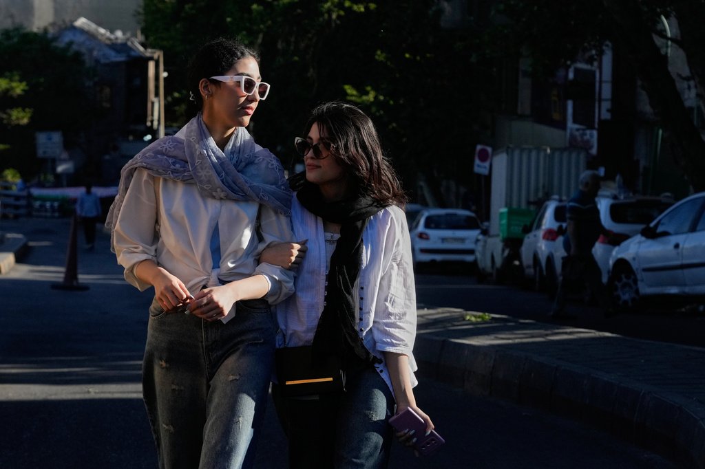 File photo: Women walk in northern Tehran, Iran, May 10, 2026 | Photo: Vahid Salemi / AP Photo