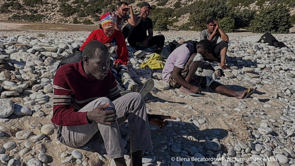 David, a migrant from South Sudan, sits at Tripiti beach with five others from a group of 68 migrants and refugees who arrived on the island of Gavdos, Greece, on Monday, July 7, 2025, as hundreds were rescued in recent days near the island and off Crete in separate incidents | Photo: Elena Becatoros / picture alliance / dpa