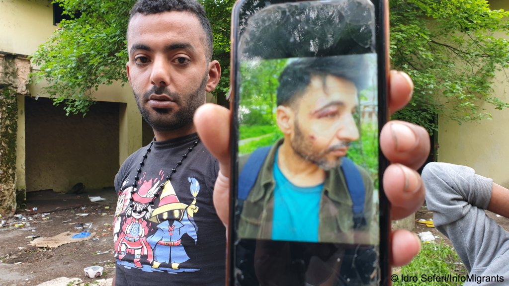 One of the men shows Idro and András pictures of a friend who he says was struck by border guards when the group attempted to cross into the EU | Photo: Idro Seferi / InfoMigrants