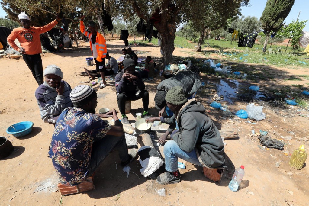 File photo: Sub-Saharan African migrants sitting near their tents at a camp in Jebeniana, Sfax governorate, Tunisia, May 4, 2024 | Photo: EPA / Mohamed Messara