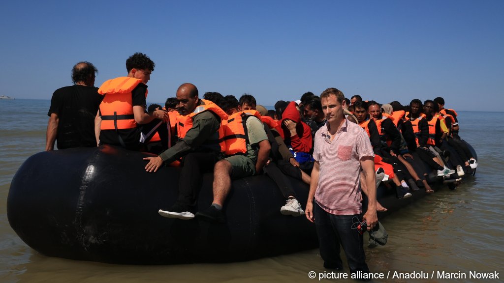 UK Shadow Home Secretary Chris Philp, pictured here in July 2026 in front of a boat of migrants hoping to reach Britain, said that the contents of the pamphlet prove how certain foreign cultures are 'incompatible' with Western values | Photo: Marcin Nowak / ANADOLU / AFP