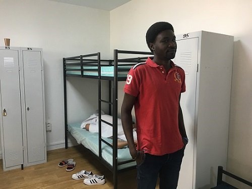 From file: A Sudanese migrant in one of the shared accommodation dormitories run by CAES | Photo: InfoMigrants