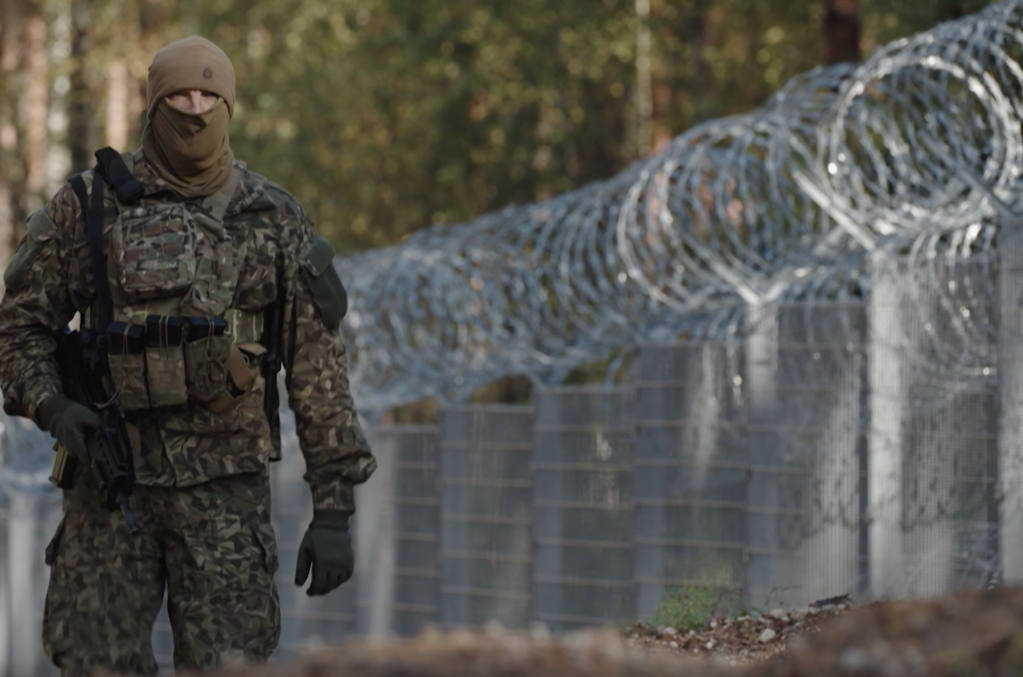 Border guards patrol the fence between Belarus and Latvia | Photo: Screenshot from DW Video