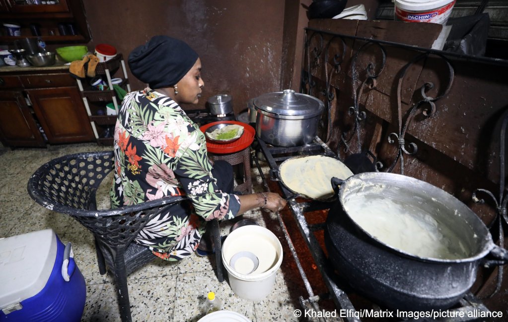 File photo: Sudanese refugee Fatheya cooks at her abode in Cairo. The majority of Sudanese refugees in Egypt are women or children | Photo. Khaled Elfiqi /Matrix Images