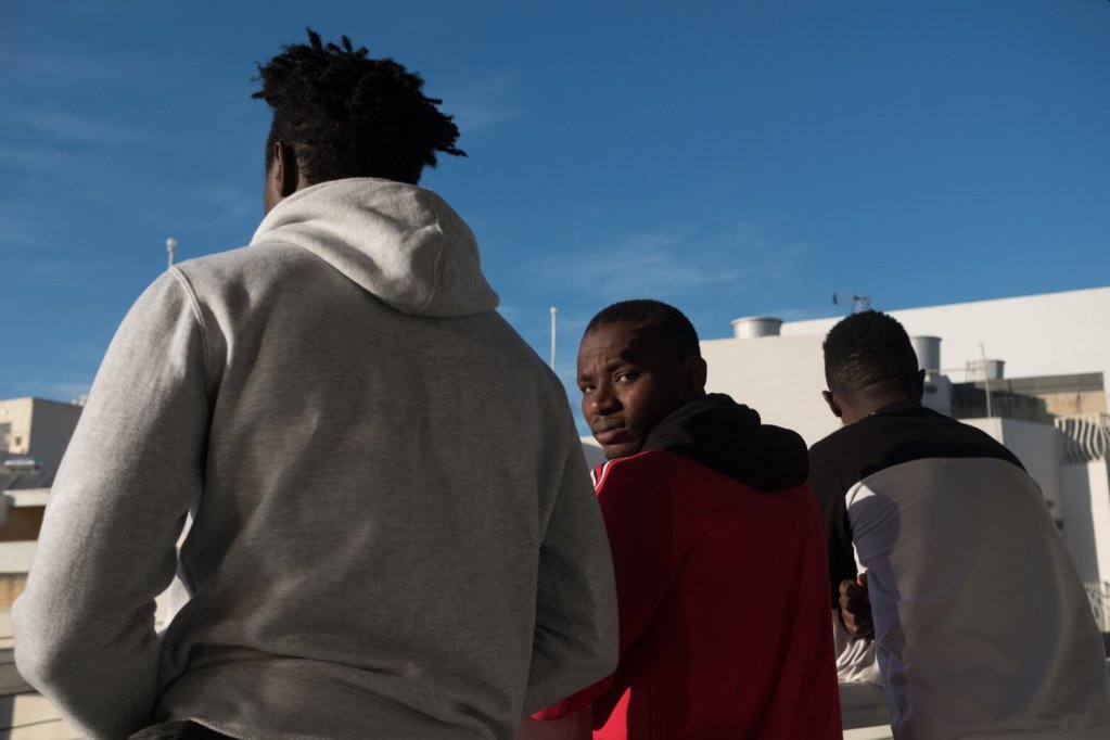 Amara, Kader and Abdalla keep busy working but the stress of the trial hanging over them is hard | Photo: Joanna De Marco / Amnesty International