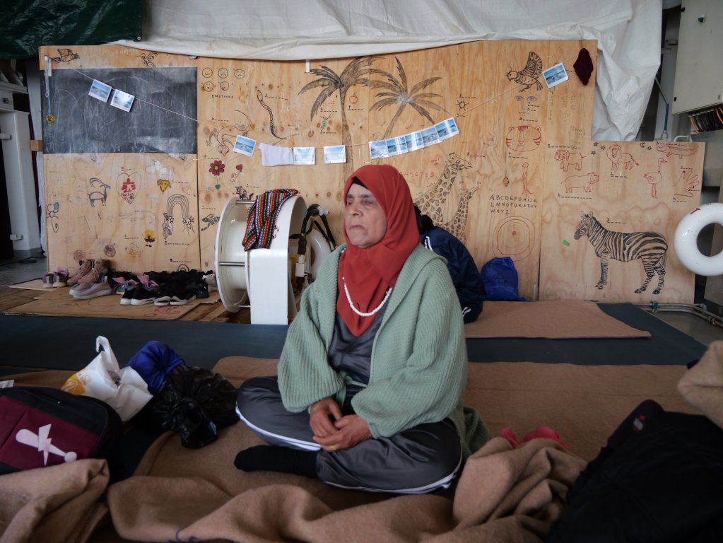 
During her journey from Syria to Libya and across the Mediterranean Sea, this blind elderly lady had to rely on her niece and young grand-nephew to guide her. The Syrian family hopes to find treatment in Europe to hopefully restore some of her vision. | Geo Barents MSF Central Mediterranean Sea February, 2024 | Photo: Sou-Jie van Brunnersum