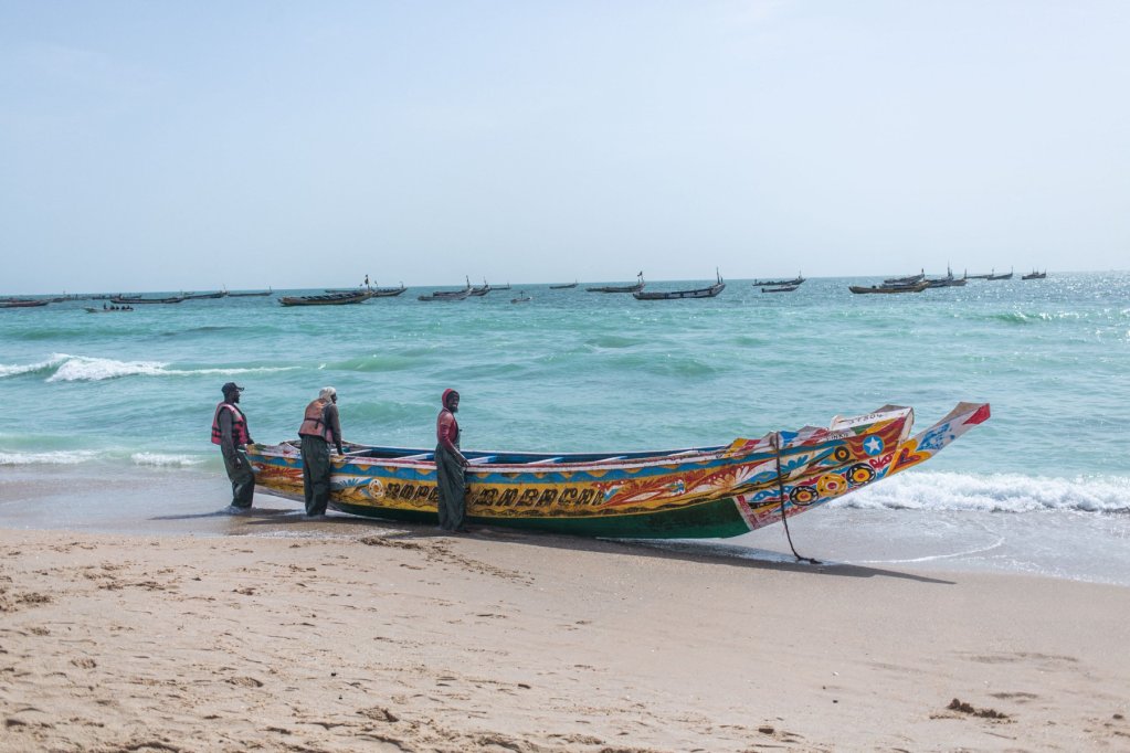 File photo: Fishermen stand beside their pirogue on a beach near Nouakchott, Mauritania, on July 24, 2024 | Photo: Med Lemin Rajel / AFP