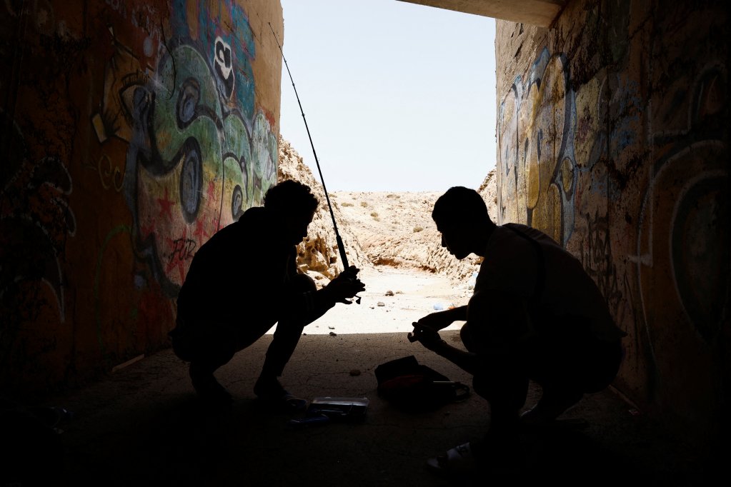 File photo used as illustration: These two minors were 18 when pictured in July 2024. After turning 18, many young migrants are left without support once they are too old to qualify for the special care centers for unaccompanied minors | Photo: Borja Suarez / Reuters